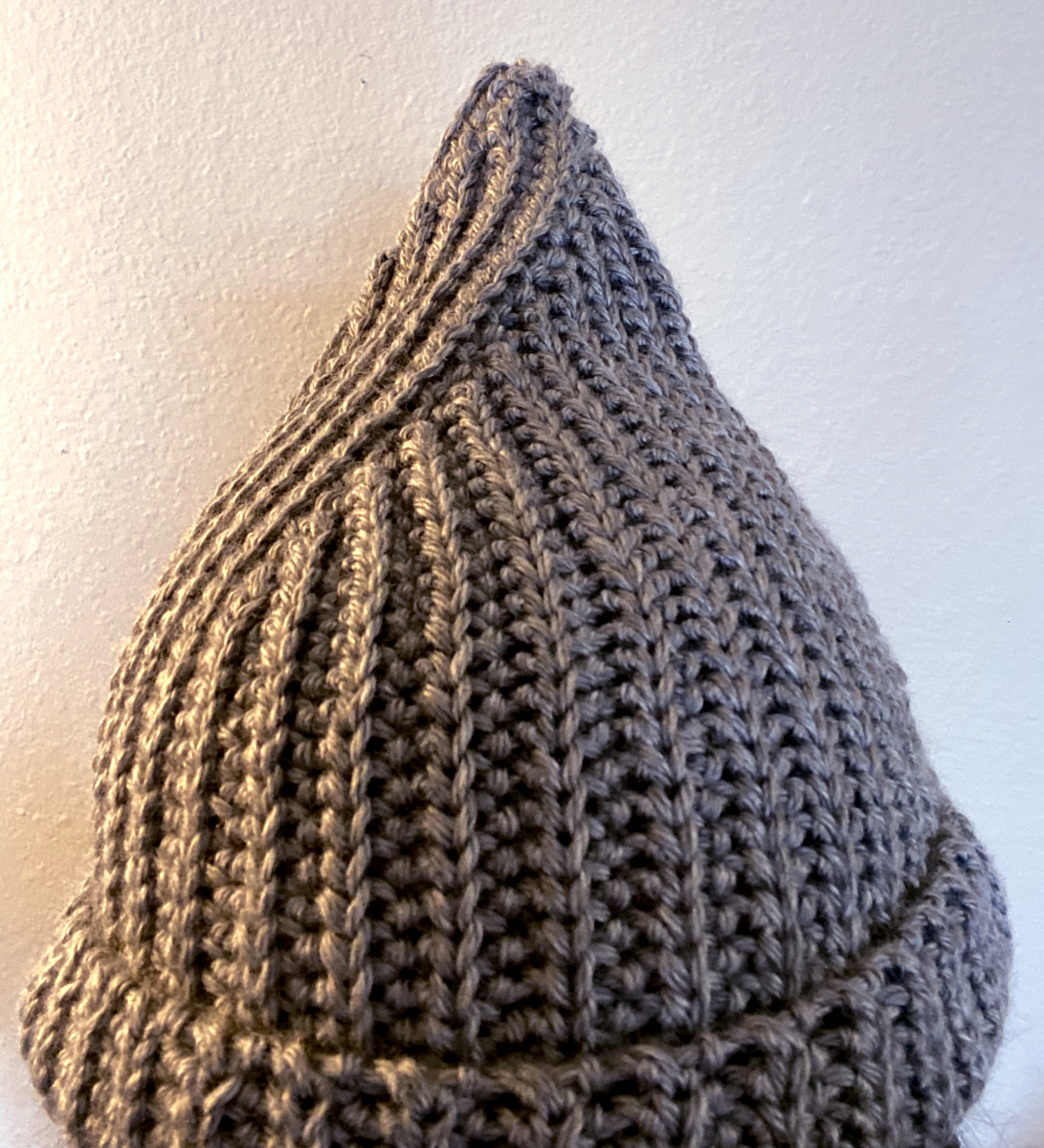 a crochet hat with a pointed tip